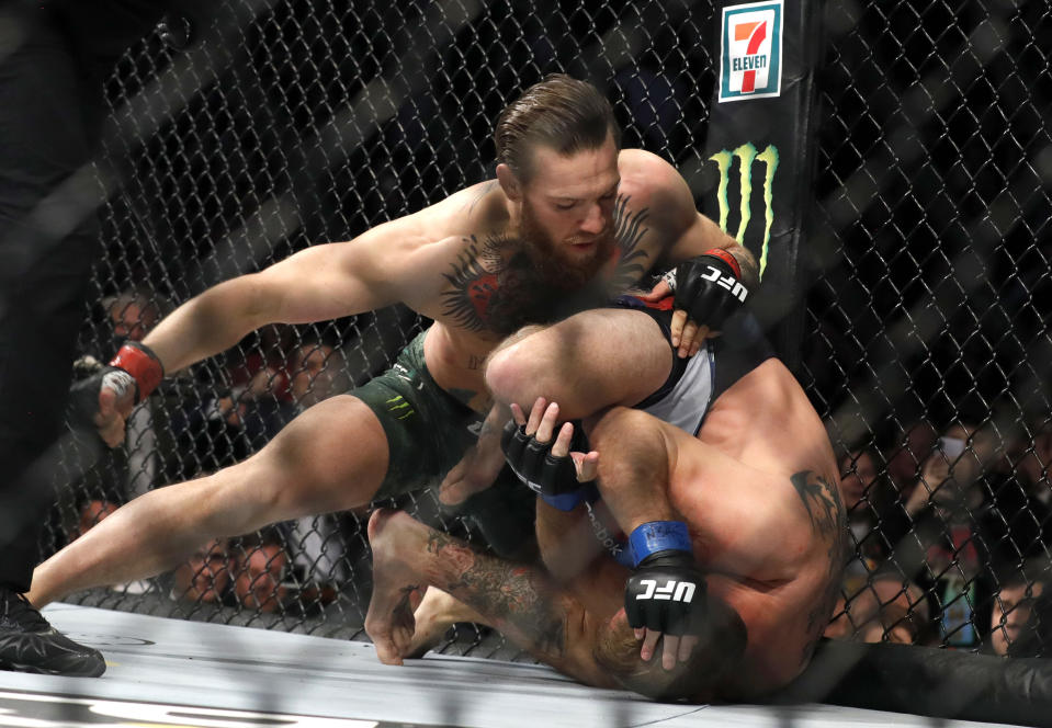 Conor McGregor punches Donald Cerrone in a welterweight bout during UFC 246 at T-Mobile Arena on Jan. 18, 2020 in Las Vegas. McGregor won by first-round TKO. (Steve Marcus/Getty Images)