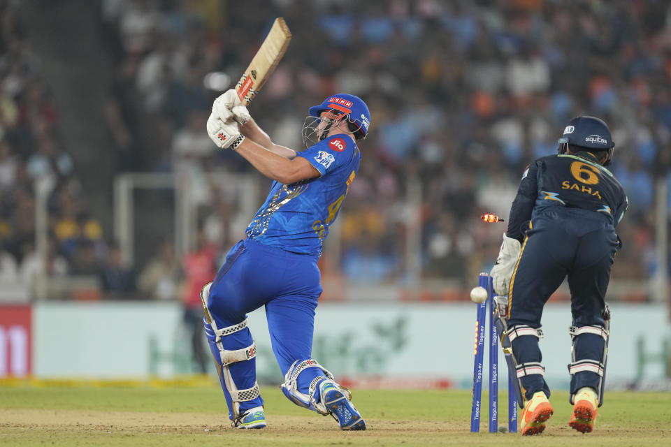 Mumbai Indian's Cameron Green is bowled out during Indian Premier League (IPL) cricket match between Mumbai Indians and Gujarat Titans, in Ahmedabad, India, Tuesday, April 25, 2023.(AP Photo/Ajit Solanki)