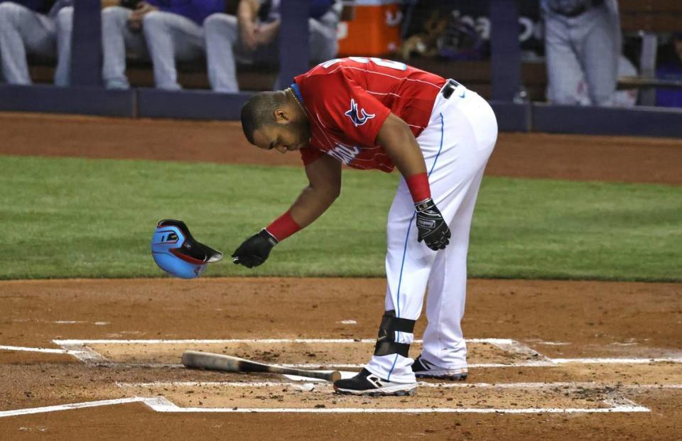 Miami Marlins first baseman Jesus Aguilar (24) reacts after striking out against New York Mets pitcher Joey Lucchesi during the first inning of their baseball game at loanDepot park on Saturday, May 22, 2021 in Miami, Florida.