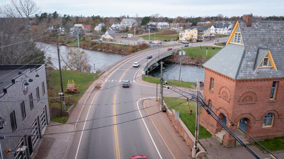 Drone aerial view of Montague, PEI. See town buildings and homes.