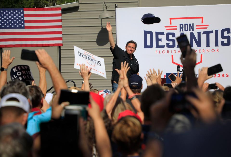 Florida Governor Ron DeSantis throws hats to his supporters at his campaign event at the 2A Ranch on Saturday, Nov. 5th, 2022 in Ormond Beach.