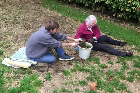 Valerie Vivian digging up the grass