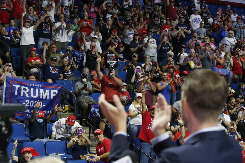 President Donald Trump supporters cheer Eric Trump, the son of President Donald Trump, before a Trump campaign rally in Tulsa, Okla., Saturday, June 20, 2020. (AP Photo/Sue Ogrocki)