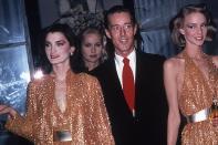 <p>Halston’s career boomed after launching his first perfume in 1975. He’s photographed here with his “Halstonettes” at a fragrance launch at Saks 5th Ave.</p>