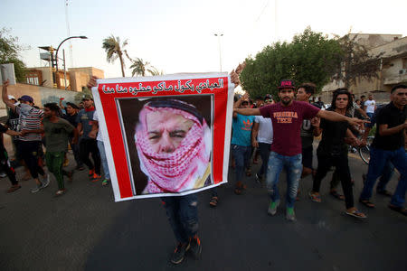 Iraqi protesters shout slogans near the main provincial government building in Basra, Iraq July 14, 2018. Picture taken July 14, 2018. REUTERS/Essam al-Sudani