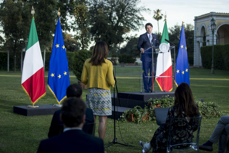 Italian Premier Giuseppe Conte meets the media after a meeting of Italian economists, members of the government and top industrialists in the historical Villa Pamphili, to discuss ideas to relaunch economy after COVID-1 pandemic, in Rome Sunday, June 21, 2020. (Roberto Monaldo/LaPresse via AP)