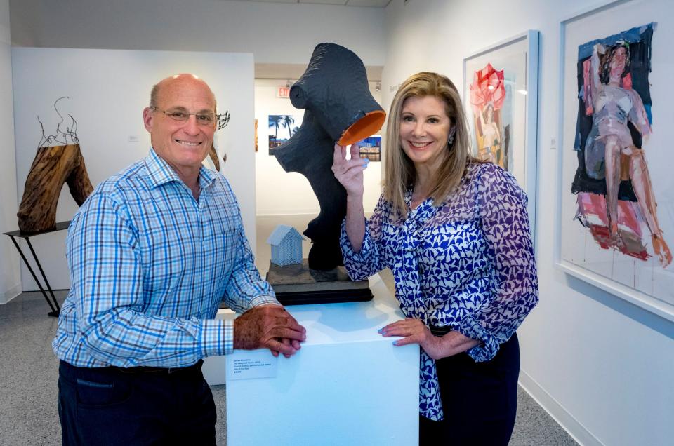 James and Eleanor Woolems stand surrounded by their artwork at the Cultural Council of Palm Beach County in 2018.