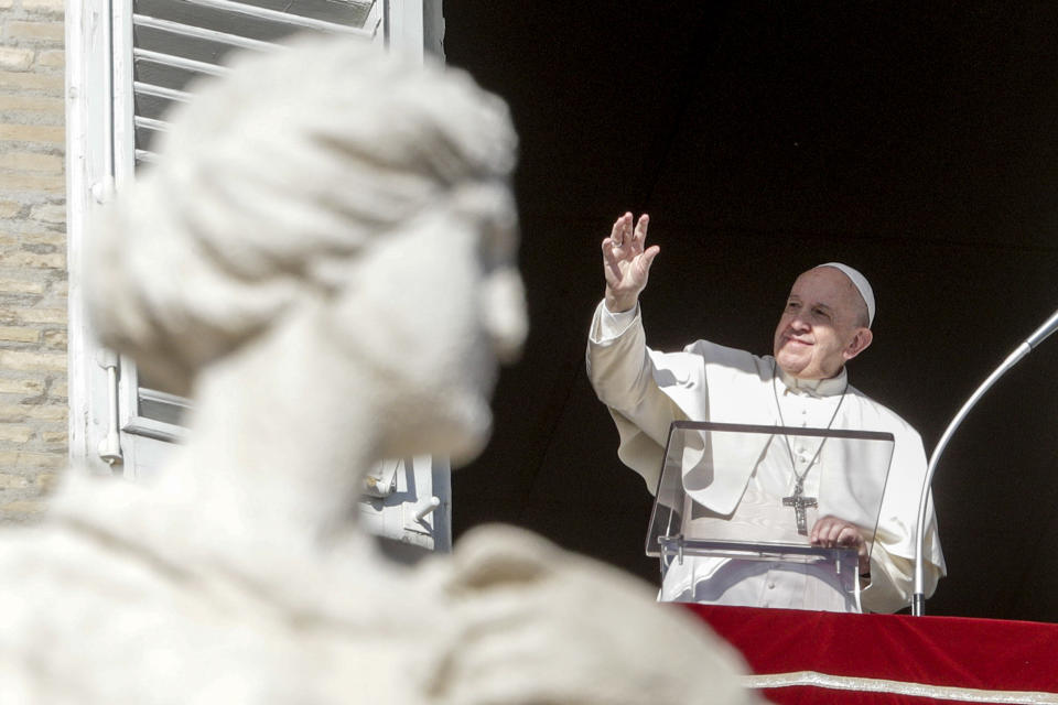 Pope Francis delivers his blessing as he recites the Angelus noon prayer from the window of his studio overlooking St.Peter's Square, at the Vatican, Thursday, Dec. 26, 2019. (AP Photo/Andrew Medichini)