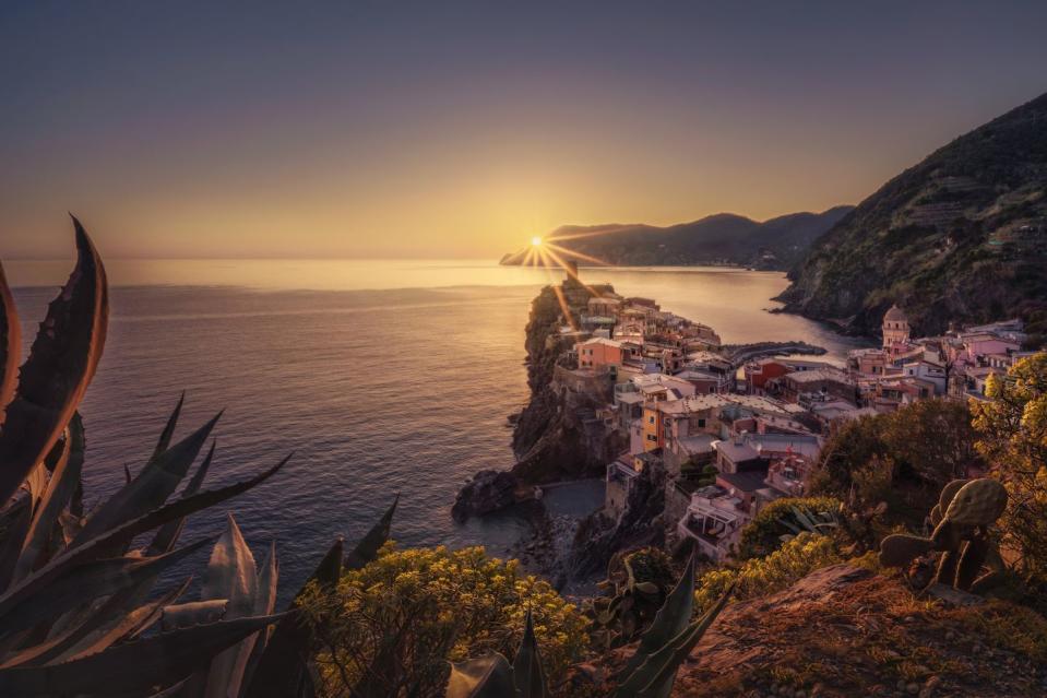 <p>Sunset over the village of Vernazza in Cinque Terre, Italy. </p>