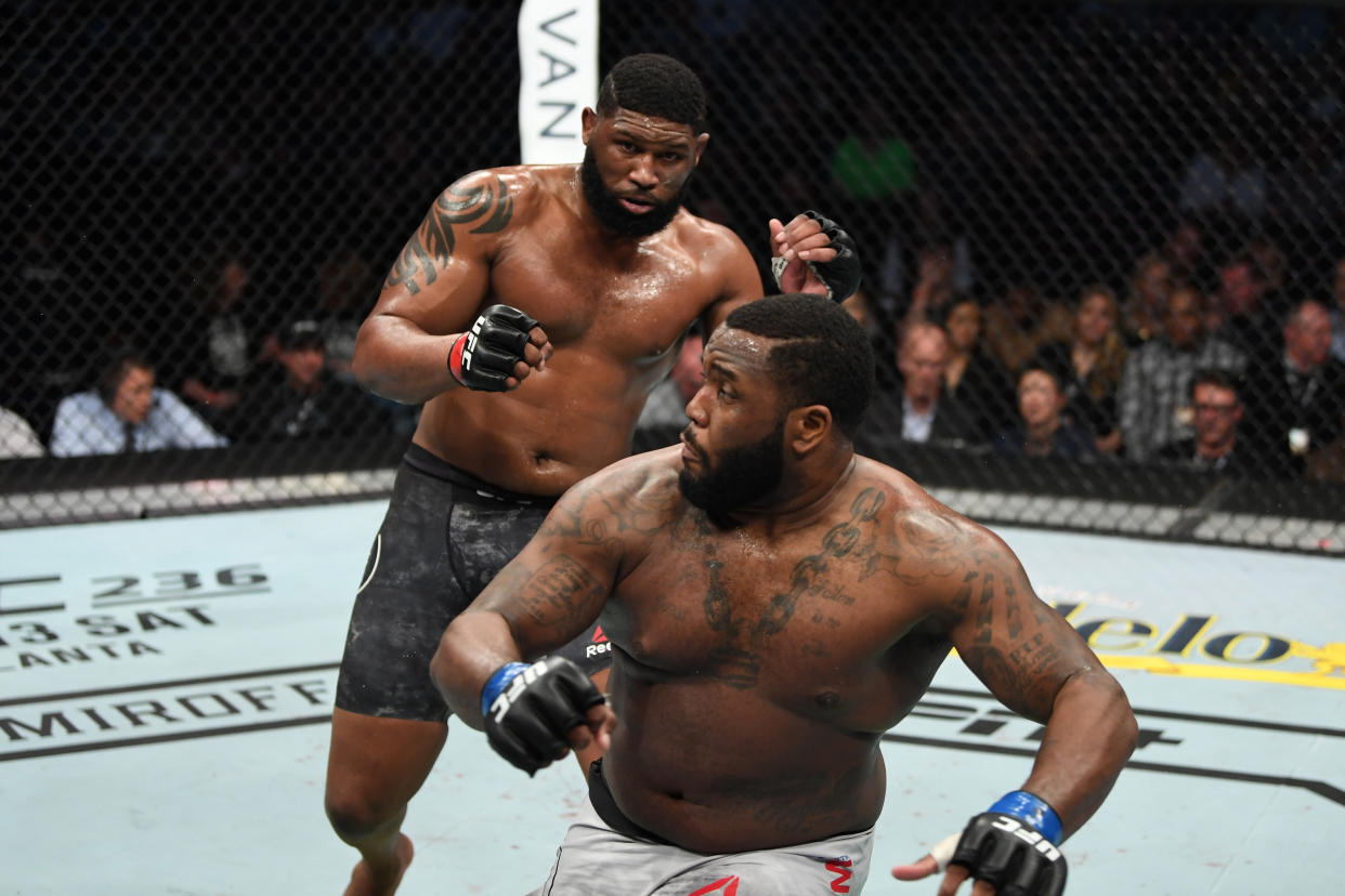 NASHVILLE, TENNESSEE - MARCH 23:  (L-R) Curtis Blaydes knows down Justin Willis in their heavyweight bout during the UFC Fight Night event at Bridgestone Arena on March 23, 2019 in Nashville, Tennessee. (Photo by Jeff Bottari/Zuffa LLC/Zuffa LLC via Getty Images)