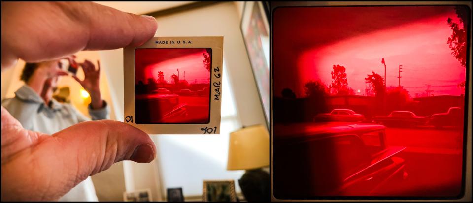 While on a trip home to San Jose, California in 2020, Andrew Dolph, a staff photographer at the Times-Reporter, views a 3 1/4 inch slide depicting a solar eclipse that likely occurred in February of 1962. The photograph was made by his grandfather, Carroll Sears Rankin, while standing in the driveway of their home in Palo Alto, California. Pictured at left is Andrew's mother, Gratia Rankin. The magnified frame is seen at right.