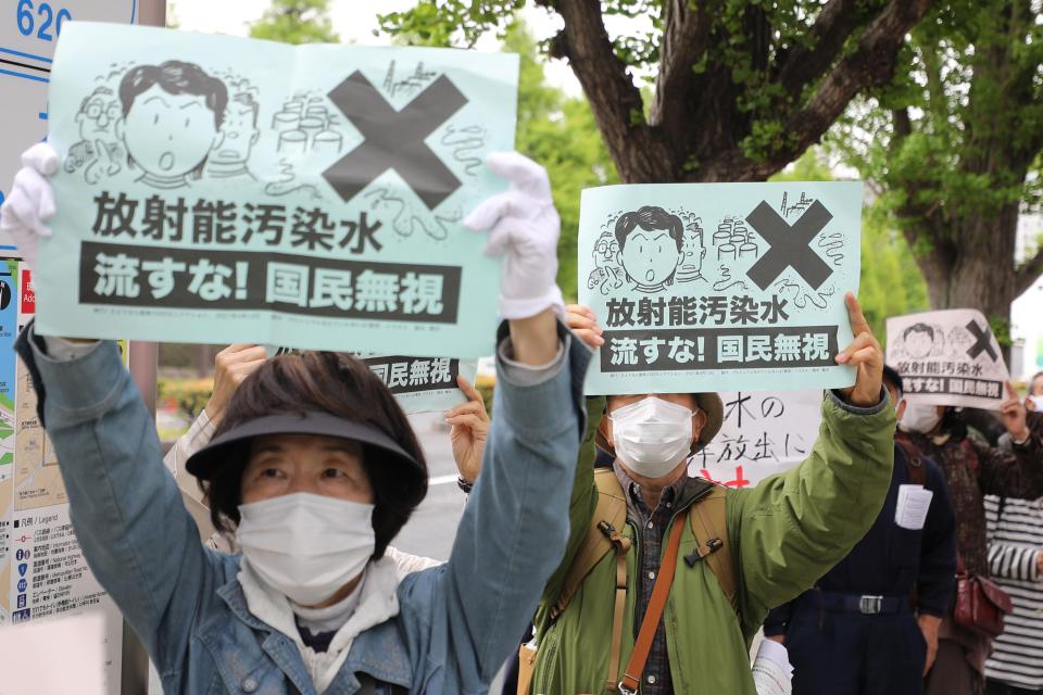 TOKYO, April 13, 2021 -- People rally to protest against the Japanese government's decision to discharge contaminated radioactive wastewater in Fukushima Prefecture into the sea, in Tokyo, capital of Japan, April 13, 2021.
  Japanese Prime Minister Yoshihide Suga said on Tuesday that his government has decided to discharge contaminated radioactive wastewater in Fukushima Prefecture into the sea amid domestic and international opposition. (Photo by Du Xiaoyi/Xinhua via Getty) (Xinhua/Du Xiaoyi via Getty Images)