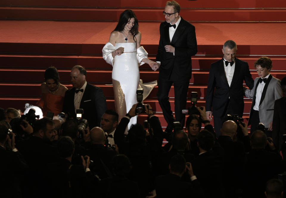 Anne Hathaway, left, and director James Gray depart after the premiere of the film 'Armageddon Time' at the 75th international film festival, Cannes, southern France, Thursday, May 19, 2022. (Photo by Joel C Ryan/Invision/AP)