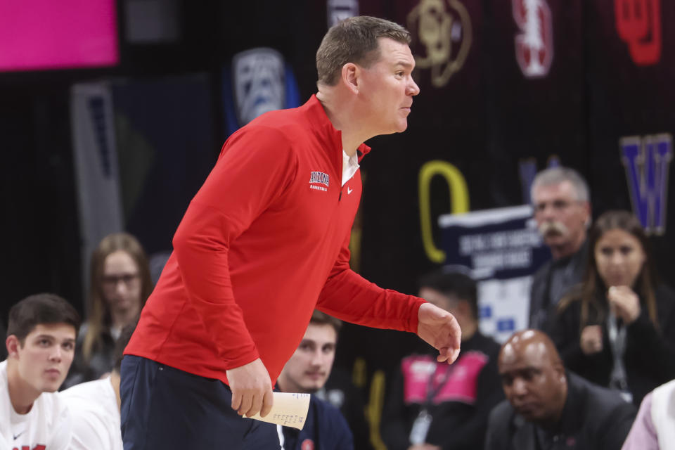 Arizona head coach Tommy Lloyd talks to his team during the first half of an NCAA college basketball game against Arizona State in the semifinals of the Pac-12 Tournament, Friday, March 10, 2023, in Las Vegas. (AP Photo/Chase Stevens)