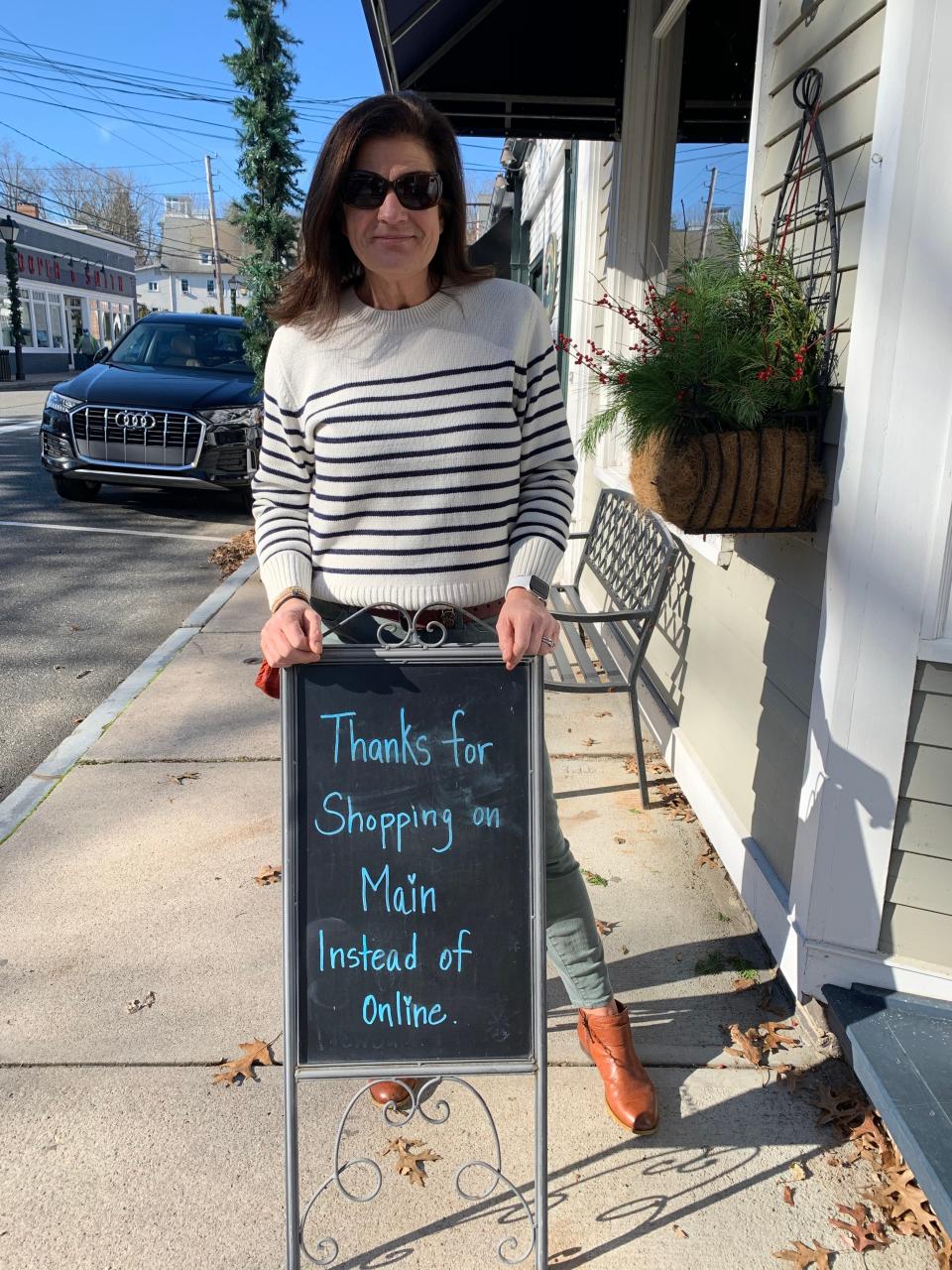 Amy D'Alessio, owner of J. Alden Women’s, a small clothing shop in Essex, Connecticut, which shares a sales space with her husband's shop, J. Alden Clothiers.