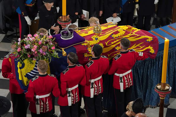 LONDON, ENGLAND - SEPTEMBER 19: The coffin is placed near the altar during the State Funeral of Queen Elizabeth II at Westminster Abbey on September 19, 2022 in London, England.  Elizabeth Alexandra Mary Windsor was born in Bruton Street, Mayfair, London on 21 April 1926. She married Prince Philip in 1947 and ascended the throne of the United Kingdom and Commonwealth on 6 February 1952 after the death of her Father, King George VI. Queen Elizabeth II died at Balmoral Castle in Scotland on September 8, 2022, and is succeeded by her eldest son, King Charles III. (Photo by Gareth Fuller - WPA Pool/Getty Images)