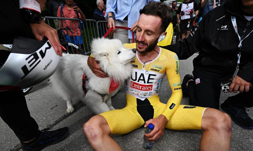 <span>Top dog: Adam Yates is greeted by his pet dog Zoe after crossing the finish line at Villars-sur-Ollon.</span><span>Photograph: Tim de Waele/Getty Images</span>