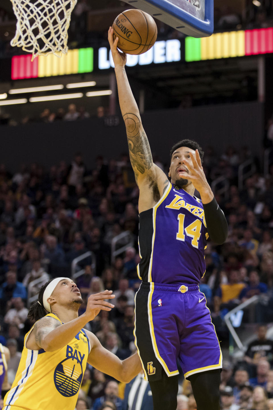 Los Angeles Lakers guard Danny Green (14) shoots as Golden State Warriors guard Damion Lee (1) defends in the first half of an NBA basketball game in San Francisco Saturday, Feb. 8, 2020. (AP Photo/John Hefti)