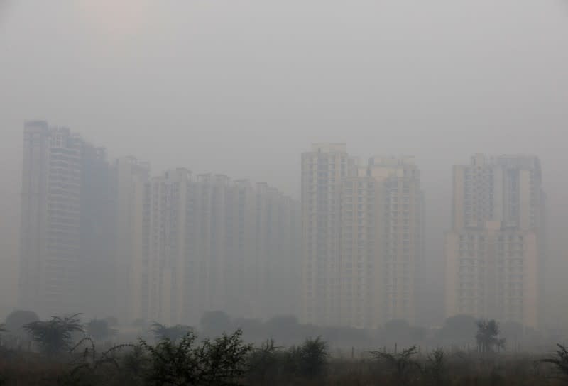 Buildings are engulfed in fog in Noida on the outskirts of New Delhi