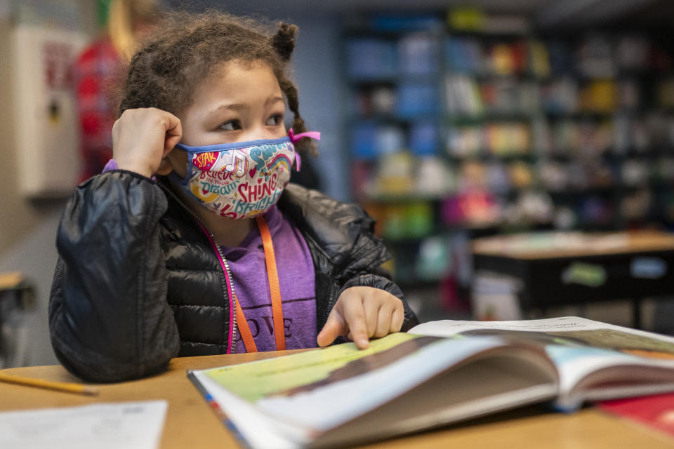 WOODLAND, WA - FEBRUARY 18: A first grade student at the Green Mountain School listens to her teacher on February 18, 2021 in Woodland, Washington. Washington state loosened in-person learning guidelines in December, sending elementary and middle school students back to the classroom a few days each week. (Photo by Nathan Howard/Getty Images)