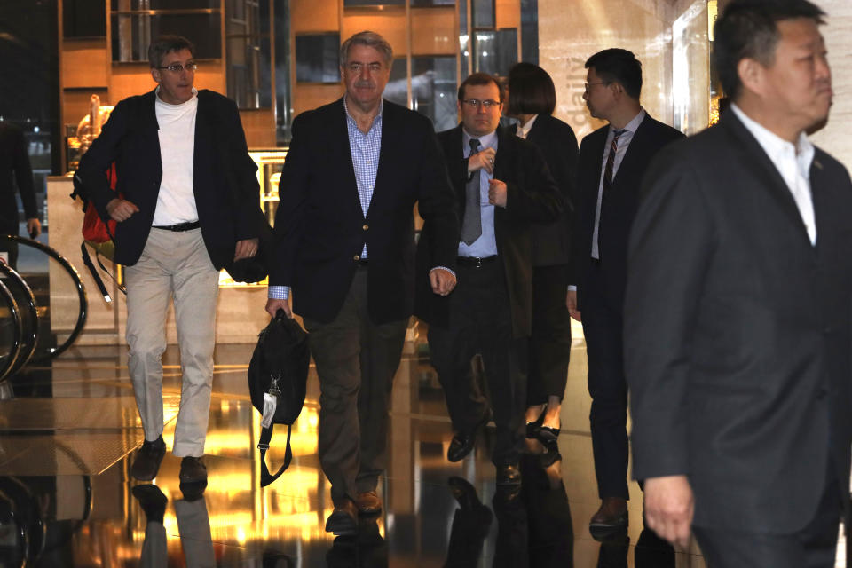 U.S. Undersecretary for Trade and Foreign Agricultural Affairs Ted McKinney, center arrives as part of a trade delegation at a hotel in Beijing, China, Sunday, Jan. 6, 2019. The U.S. delegation led by deputy U.S. trade representative, Jeffrey D. Gerrish arrived in the Chinese capital ahead of trade talks with China,(AP Photo/Ng Han Guan)