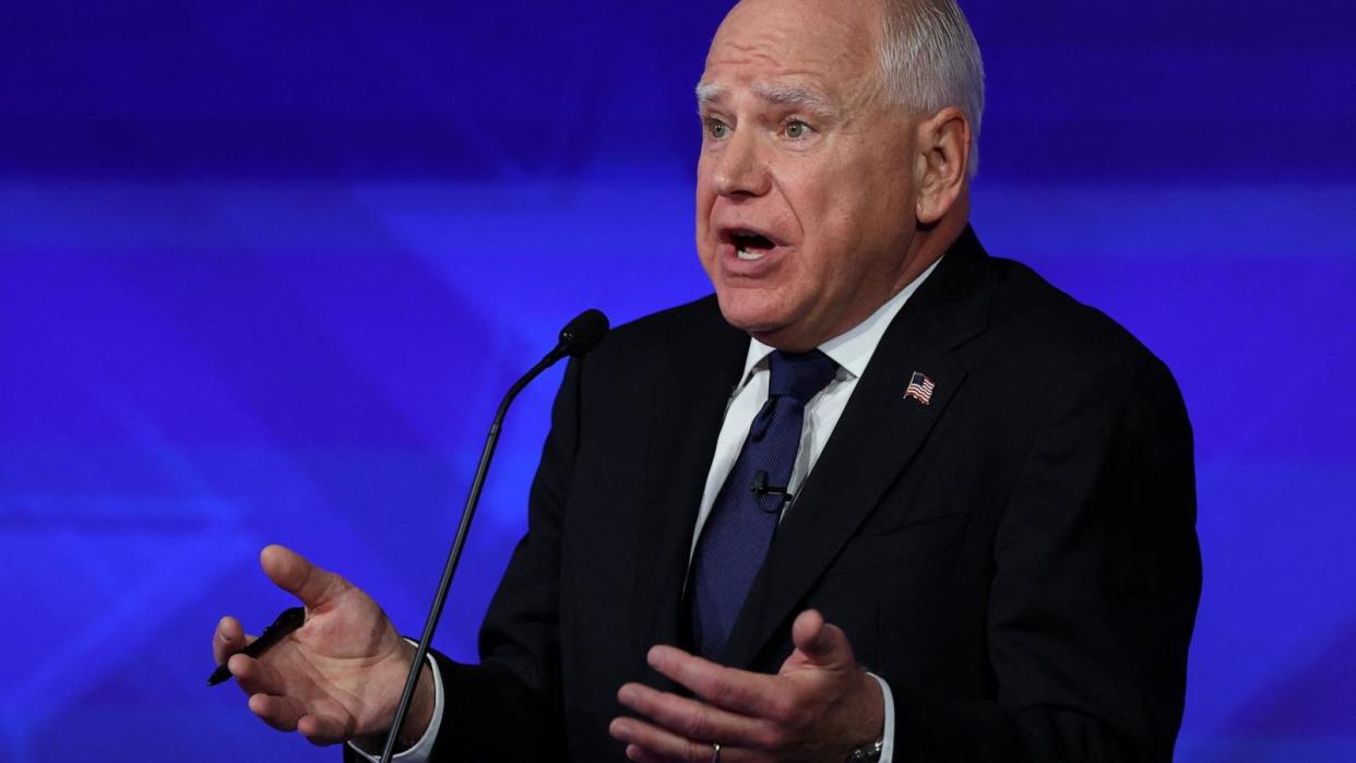 PHOTO: Democratic vice presidential nominee Minnesota Governor Tim Walz gestures as he speaks during a debate with Republican vice presidential nominee Sen. JD Vance in New York City, Oct. 1, 2024. (Mike Segar/Reuters)