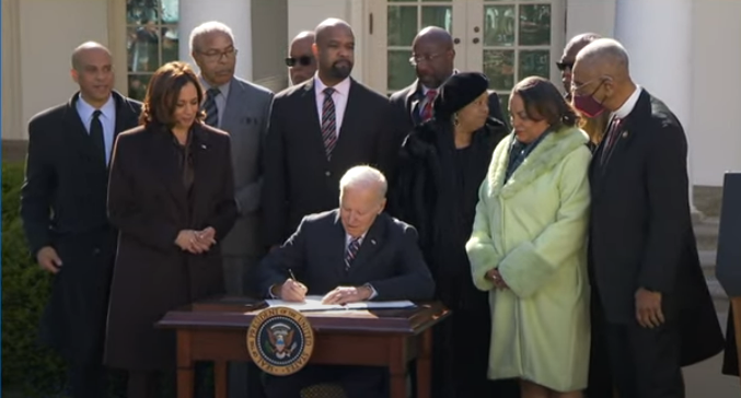 President Joe Biden signs the Emmett Till Antilynching Act into law at the White House Tuesday, March 29, 2022.