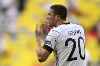 Germany's Robin Gosens celebrates after scoring his side's fourth goal during the Euro 2020 soccer championship group F match between Portugal and Germany at the Football Arena stadium in Munich, Germany, Saturday, June 19, 2021. (Philipp Guelland/Pool via AP)