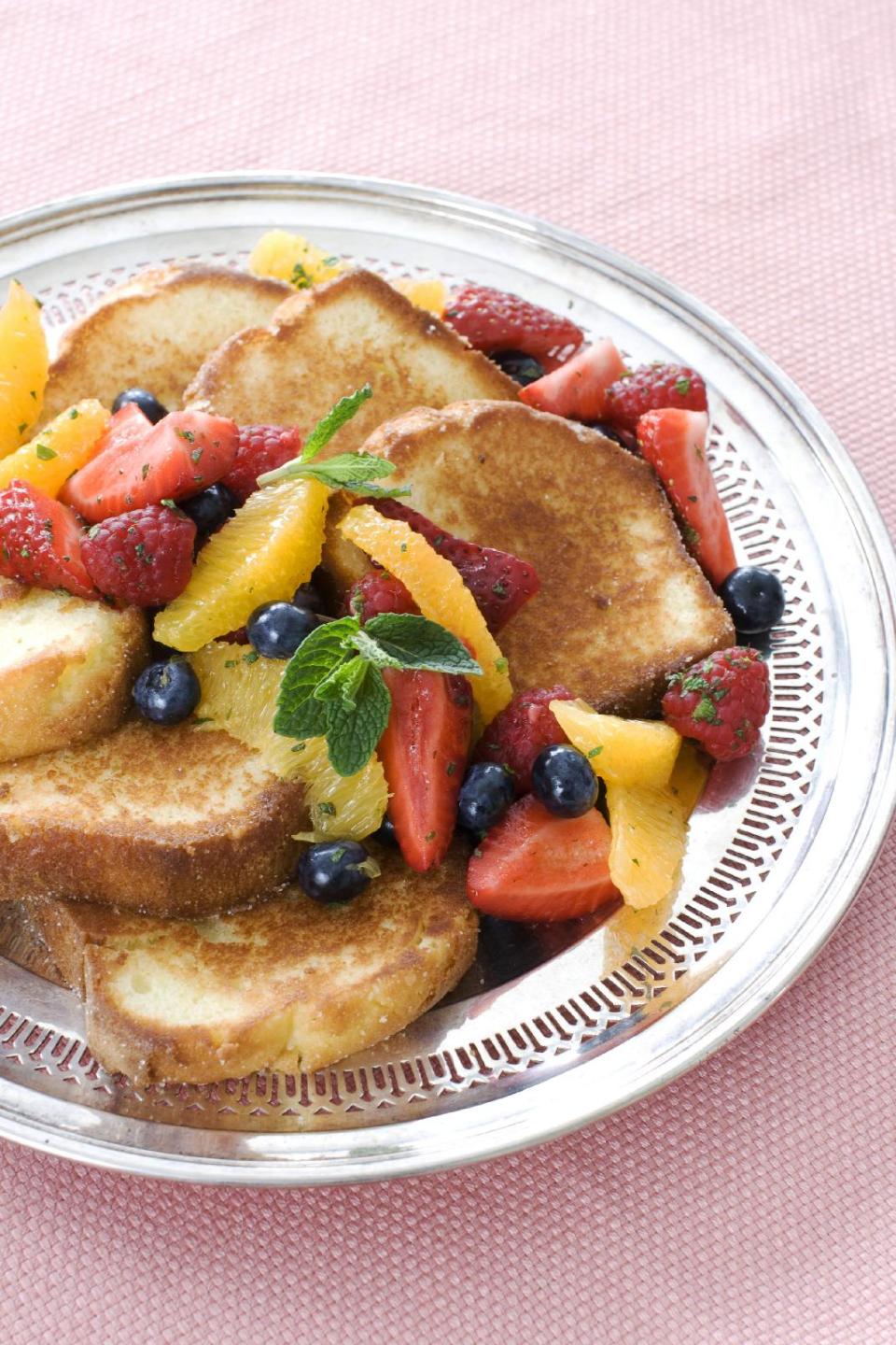 n this image taken on March 11, 2013, pan-seared pound cake with minty fruit salad is shown served on a plate in Concord, N.H. (AP Photo/Matthew Mead)