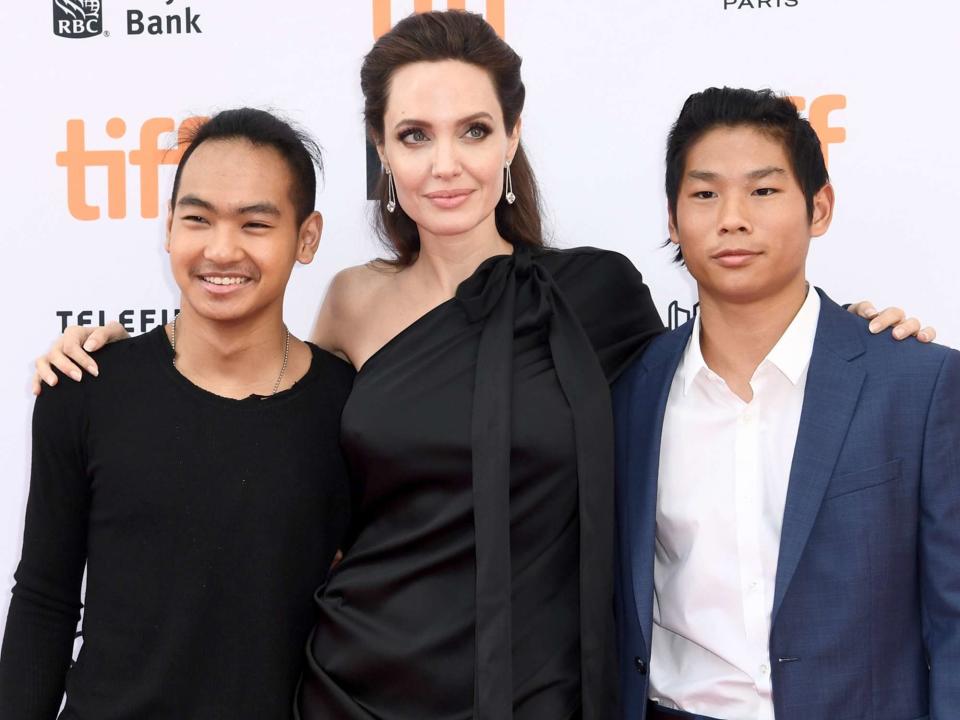 <p>Emma McIntyre/Getty</p> Maddox, Angelina Jolie and Pax on Sept. 11, 2017