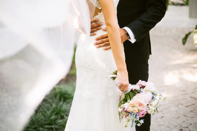 <p>Getty</p> A stock image of a bride and groom