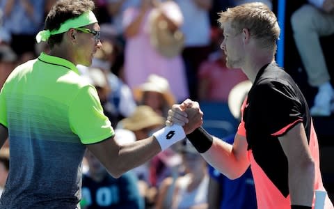 Edmund shakes hands with Istomin at the net - Credit: AP
