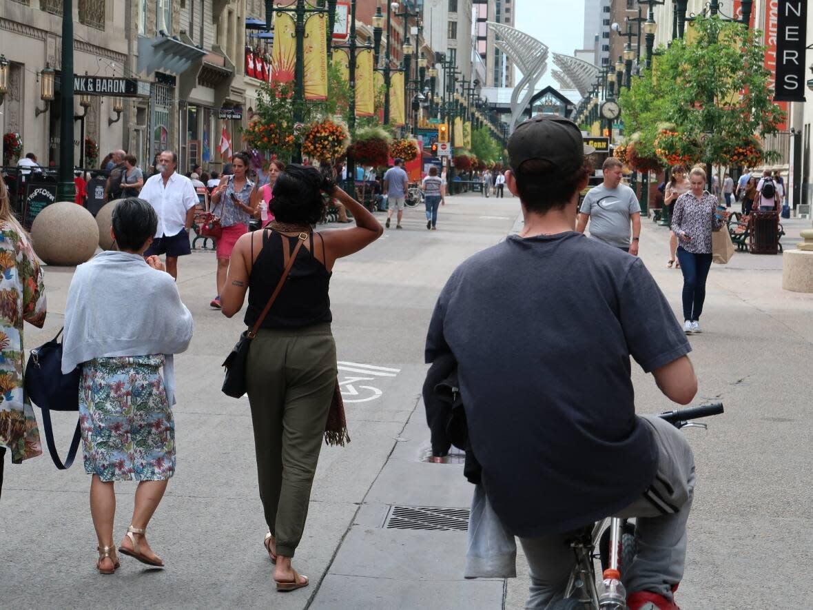 Pedestrians walk along Stephen Avenue in downtown Calgary in this file photo. (Monty Kruger/CBC - image credit)