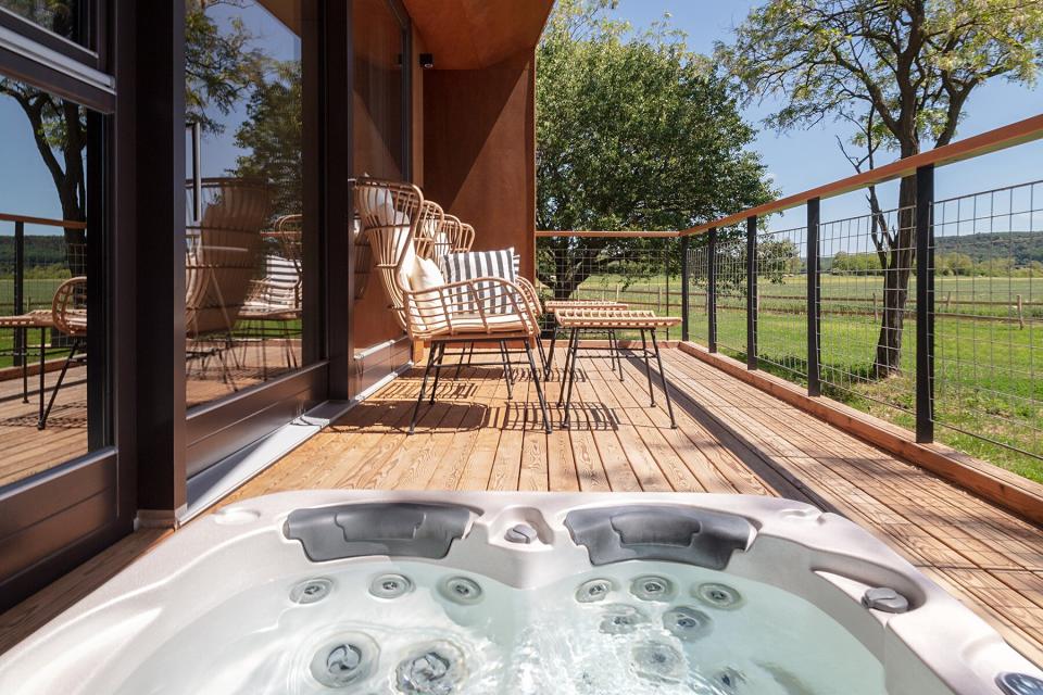 The hot tub on a balcony at The Rocks Hello Wood cabins in Hungary's Balaton Uplands