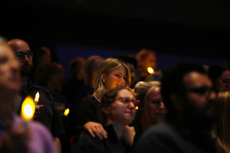 Mourners are seen at a vigil for families of victims of a mass shooting in Thousand Oaks, California, U.S. November 8, 2018. REUTERS/Eric Thayer