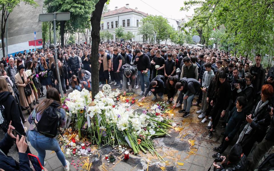 chool children and families gather to light candles for the victims near the 'Vladislav Ribnikar' elementary school - Srdjan Stevanovic