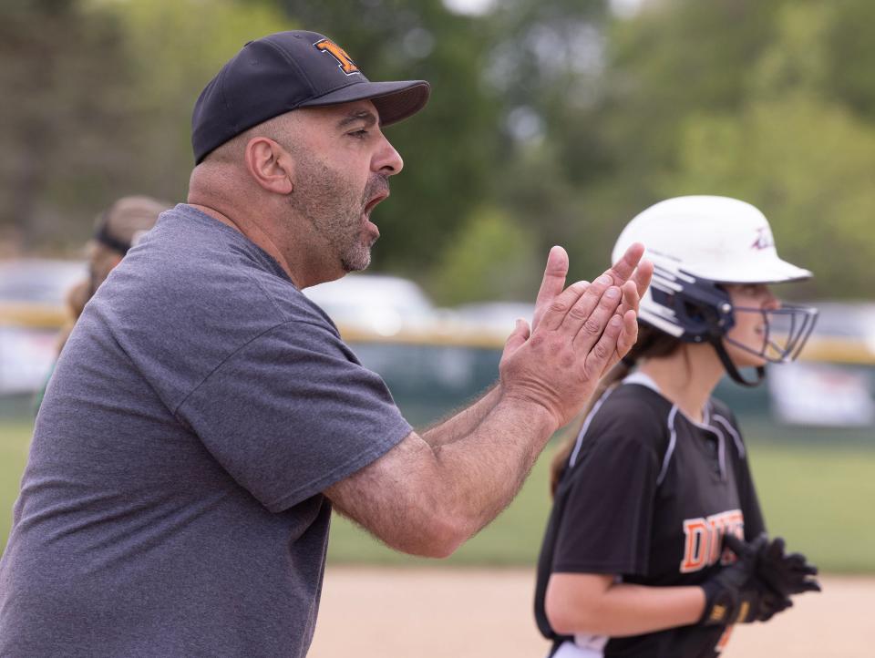 Marlington varsity softball coach Joe Tagliarini works with his girls at the Div. II district semifinal game against West Branch Tuesday, May 16 , 2023.