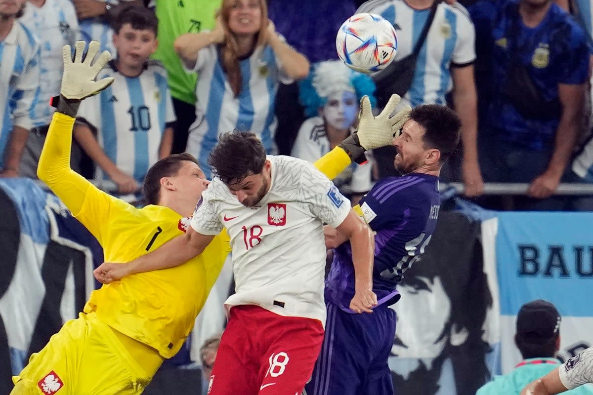 Wojciech Szczesny conceded a controversial penalty for this challenge on Lionel Messi in Doha  (AP)