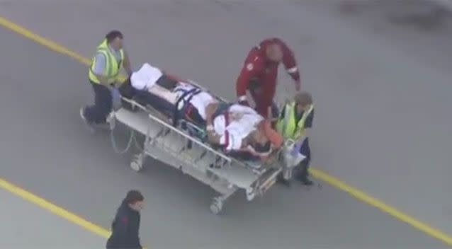 Mr Travaglini was transported to hospital after being bitten by a shark. Source: 7 News