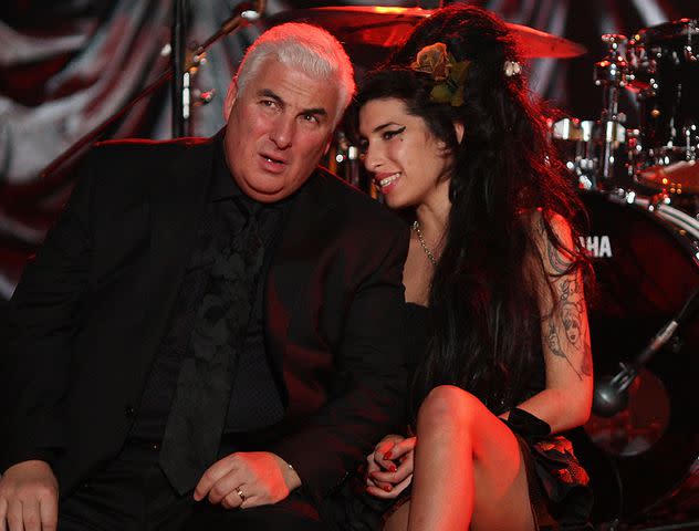 <p>Peter Macdiarmid/Getty</p> Amy Winehouse and Mitch Winehouse at at The Riverside Studios for the 50th Grammy Awards ceremony on February 10, 2008 in London, England.