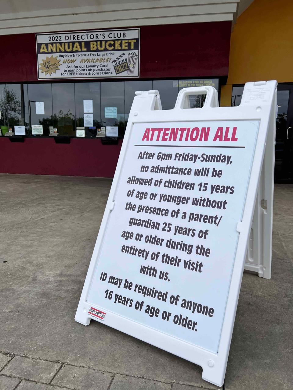 A sign outside Ridge Cinema 8 in Pace announces that children 15 or under are not allowed to see movies with adult supervision.