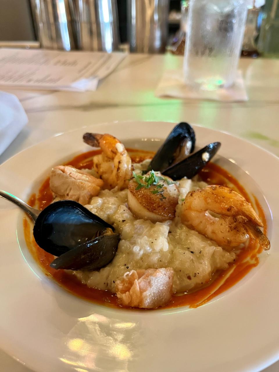 Sage on 47th's seafood risotto is one of our favorite dishes. (This is a smaller version of the dish for a quite full food writer)