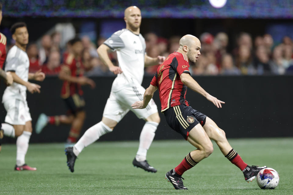 Atlanta United defender Andrew Gutman, right, fields the ball during the first half of an MLS soccer match against Toronto FC, Saturday, March 4, 2023, in Atlanta. (AP Photo/Alex Slitz)