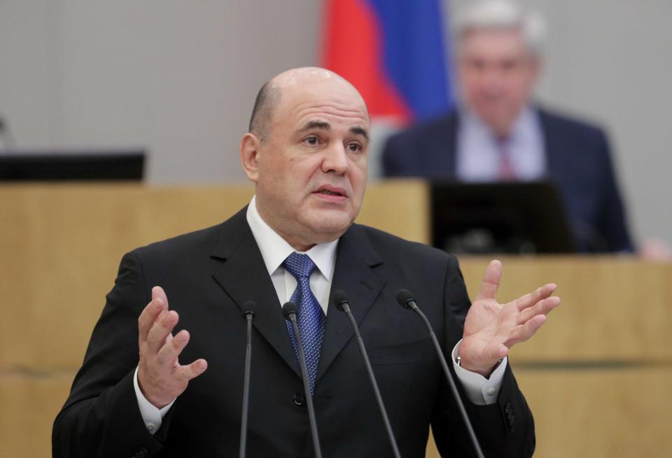 In this handout photo provided by The State Duma, The Federal Assembly of The Russian Federation, Russian Tax Service chief Mikhail Mishustin, who was nominated to replace Medvedev, gestures while speaking during a session at the State Duma, the Lower House of the Russian Parliament in Moscow, Russia, Thursday, Jan. 16, 2020. 53-year-old Mishustin, the longtime chief of Russia's tax service, was tapped for the post by President Vladimir Putin. The lower house of Russia's parliament, the Duma, quickly appointed Mishustin as prime minister on Thursday. (The State Duma, The Federal Assembly of The Russian Federation via AP)