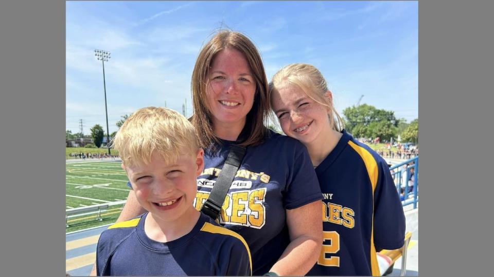 Carly Walsh and her children Hunter and Madison at track event at St. Anthony Catholic Elementary School in Harrow.
