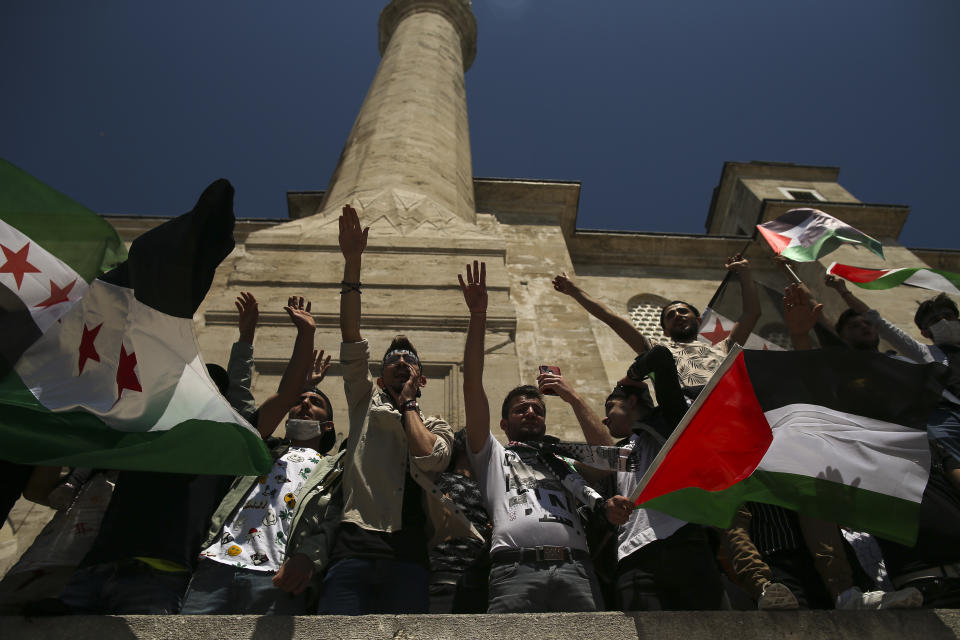 Protesters chant anti-Israel slogans during a rally outside Fatih mosque in Istanbul following Friday prayers, Friday, May 4, 2021, in support of Palestinians, killed in the recent escalation of violence in Jerusalem and the Gaza Strip. People in Turkey have been demonstrating against Israel this week and have gathered without much interference from the police despite a strict lockdown to curb COVID-19 infections that have ordered people to stay home until May 17.(AP Photo/Emrah Gurel)