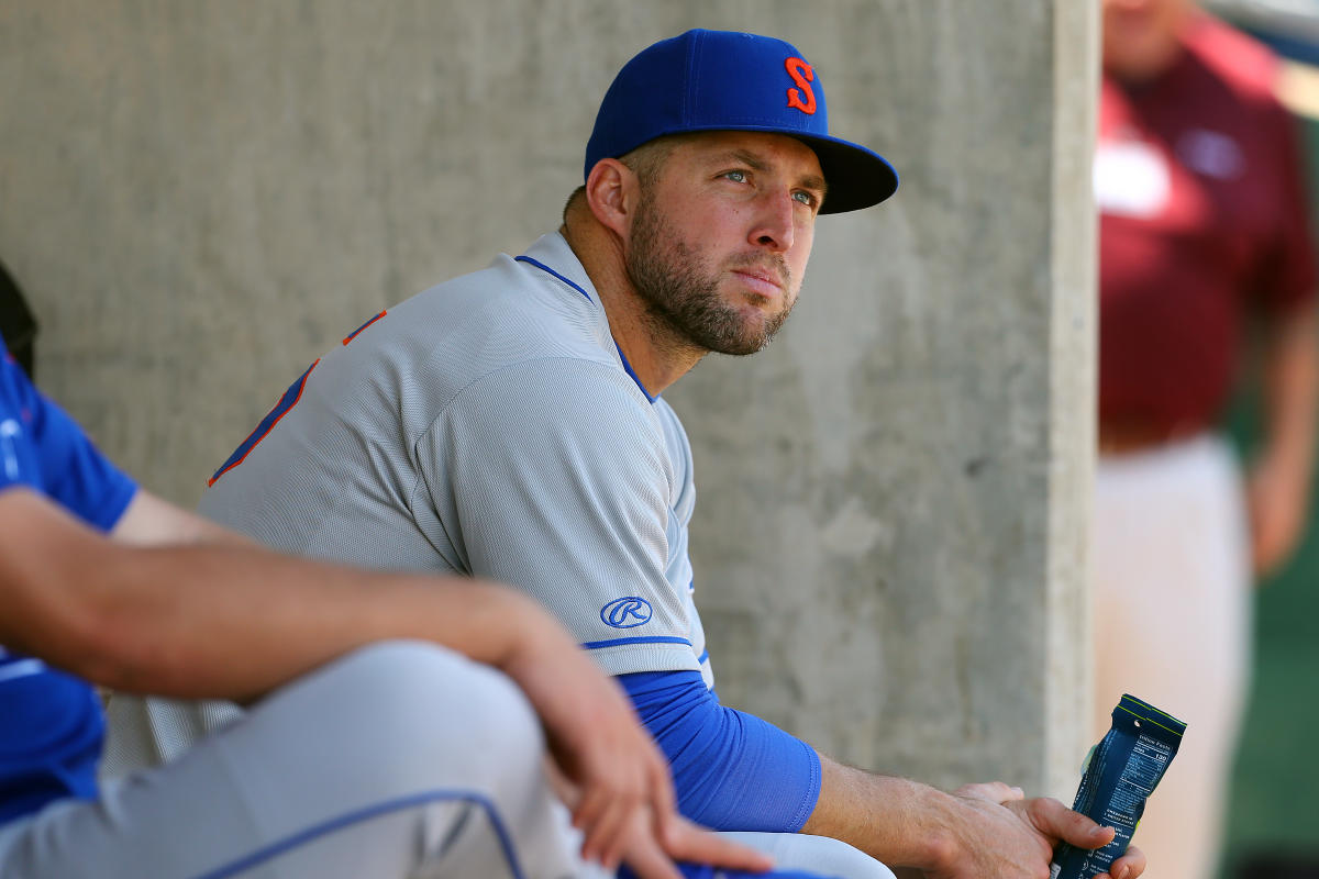 Tim Tebow took one off the head in the outfield (Video)