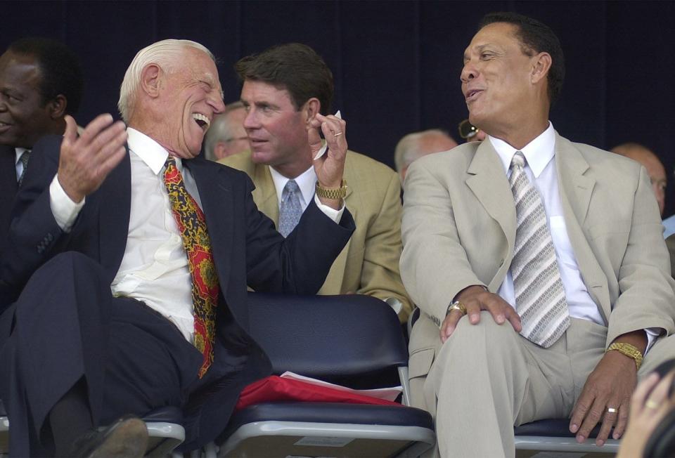 Sparky Anderson, left, and Tony Perez share a laugh at the National Baseball Hall of Fame induction ceremony in Cooperstown, New York, in 2000.