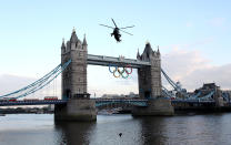 LONDON, ENGLAND - JULY 20: The Olympic flame arrives in London onboard a Sea King Helicopter during the London 2012 Olympic Torch Relay on July 20, 2012 in London, England. The Olympic Flame is now on day 63 of a 70-day relay involving 8,000 torchbearers covering 8,000 miles. (Photo by Jan Kruger/Getty Images)