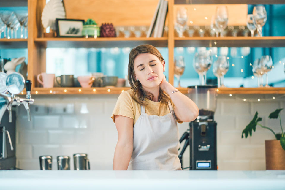 stressed waitress closing her eyes